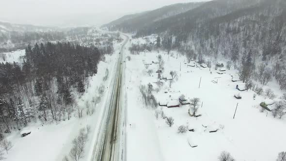 Drone's Camera Show Cars on Traffic During Snow