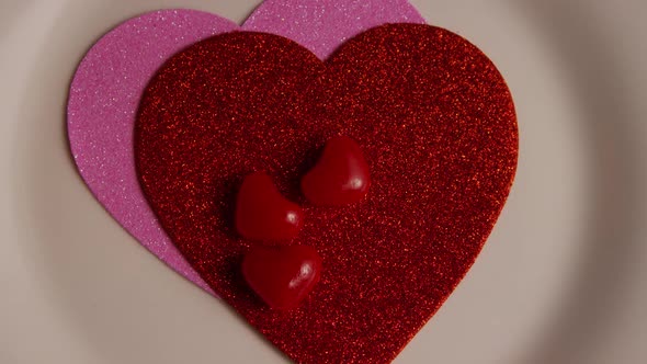 Rotating stock footage shot of Valentines decorations and candies - VALENTINES 0119