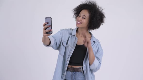 Young Happy African Woman Taking Selfie