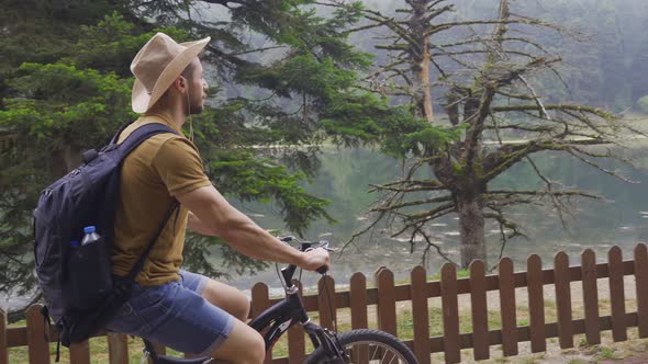 Tourist man traveling by bike.