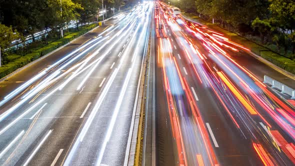 Time lapse of busy traffic and modern buildings in Beijing city , China.