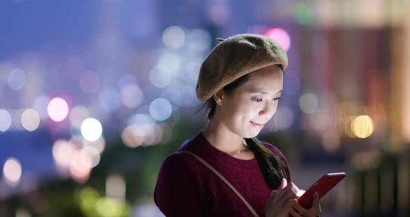 Woman use of cellphone in city