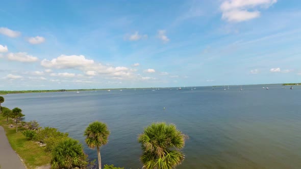 Indian River near the City of Titusville Florida on a beautiful morning with palm trees and clouds