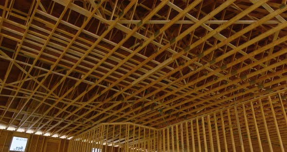 View of a New Wooden Building Under Construction with Wooden Beams and Wooden Trusses