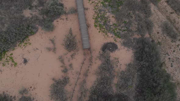 Walkway to Matadouro Beach. Aerial top-down forward