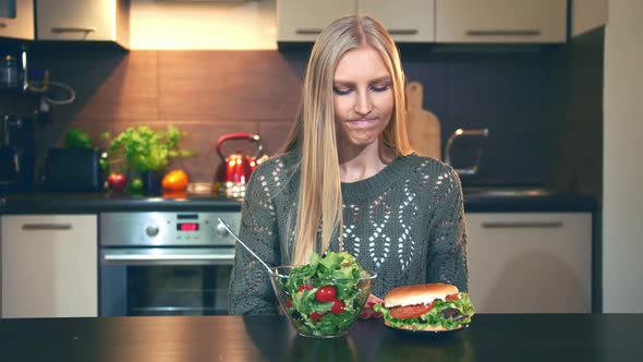 Girl Preferring Salad To Hamburger.
