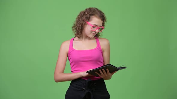 Young Happy Beautiful Nerd Woman Reading Book