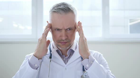 Headache, Tired Doctor with Pain in Head