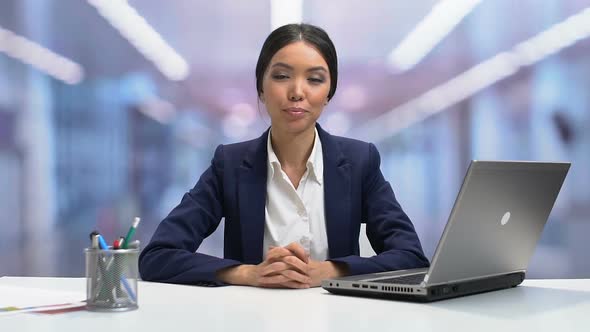 Young Self-Confident Businesslady Looking to Camera and Smiling, Slow-Motion