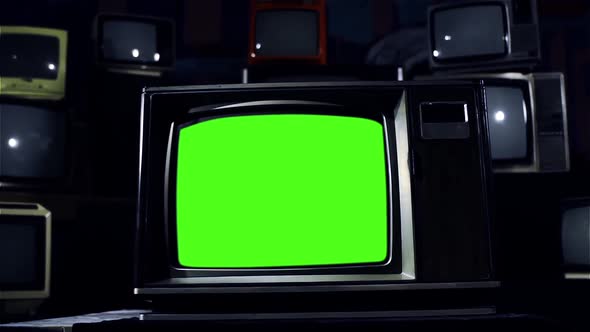 Old Television with Green Screen Over a Retro TV Wall. Dolly Out.