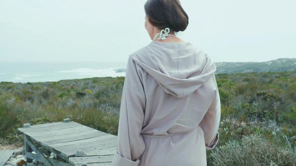 Woman walking on boardwalk