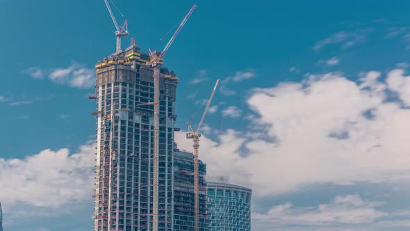 Cranes Working on Modern Constraction Site Works of New Skyscraper Timelapse