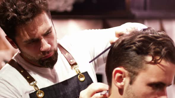 Man getting his hair trimmed with razor