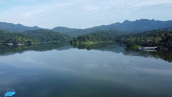 Aerial view of a calm morning atmosphere in an artificial lake or reservoir in Yogyakarta, Indonesia