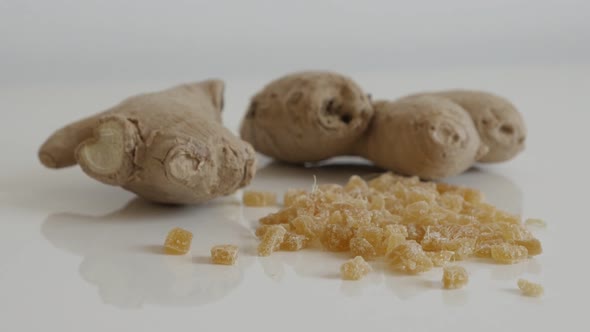Pile of candied  ginger root slow tilt 4K 2160p 30fps UltraHD footage - Cubes of crystallized Zingib
