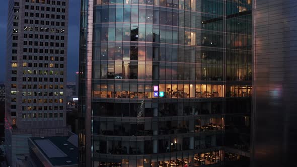 Footage of Modern Futuristic Office Skyscraper Reflecting Sunset Sky