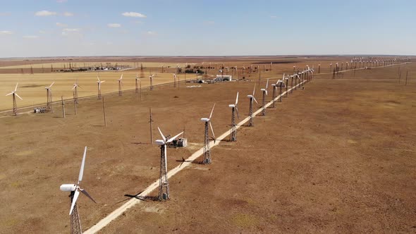 Small Wind Turbines with Blades in the Field Aerial View