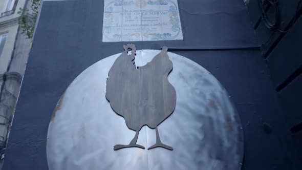 Pushout of Chicken Silhouette on Metal Sign Outside Restaurant