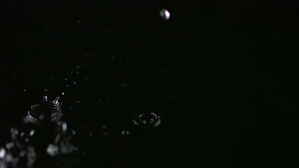 Water droplets in puddle, Slow Motion