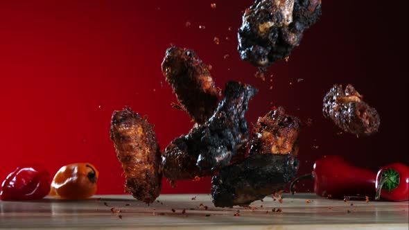 Smoked chicken wings falling and bouncing in ultra slow motion 1500fps - CHICKEN WINGS PHANTOM 