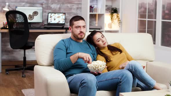 Caucasian Couple Relaxing Watching Tv in Living Room