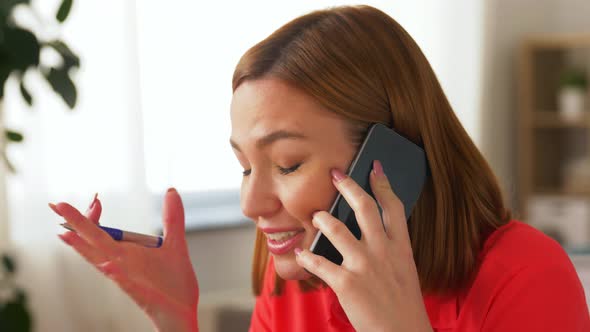 Angry Woman Calling on Smartphone at Home Office