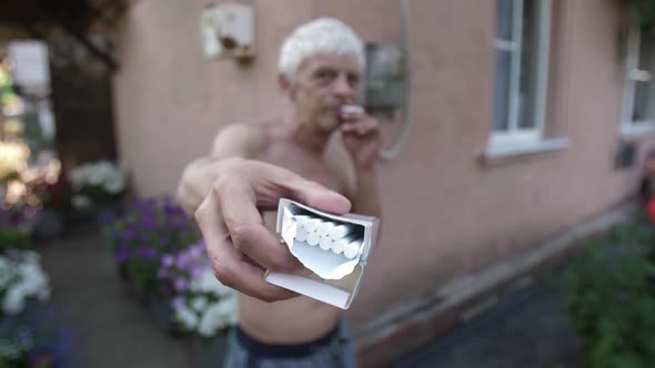 Addicted Man Offers a Cigarette