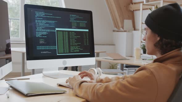 Caucasian Man Developing Software in Office