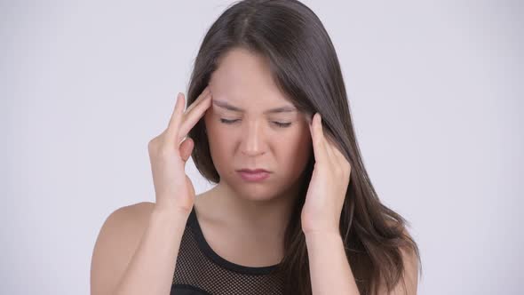 Young Stressed Multi-ethnic Woman Having Headache Ready for Gym