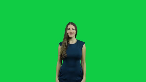 Sexy attractive girl cheering in front of a green screen