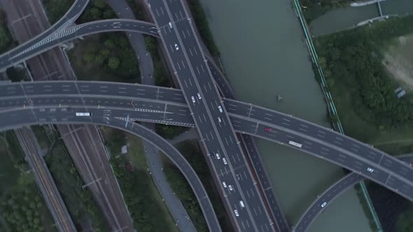 Aerial Drone View of Highway Multilevel Junction Road with Moving Cars at Sunset