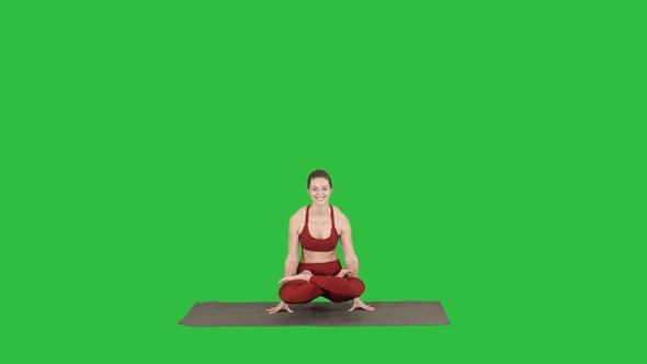 Young sporty woman practicing yoga doing Scale exercise