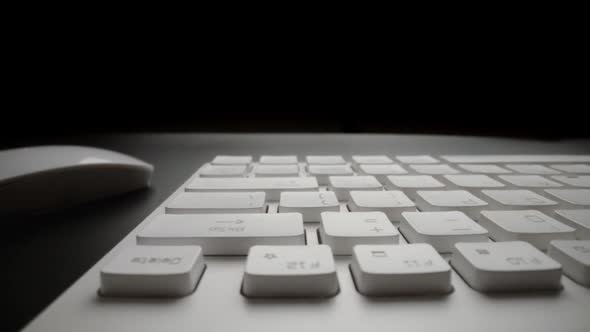 Close-up view of computer keyboard. Macro soft focus dolly shot