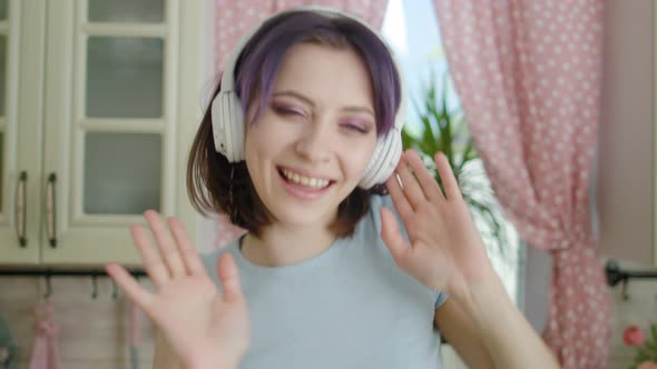 Young Beautiful Woman Dancing Kitchen At Home In Headphones