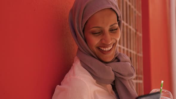 Young woman wearing hijab out and about in the city