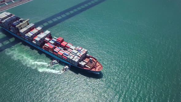 top view of cargo ship passing the harbor