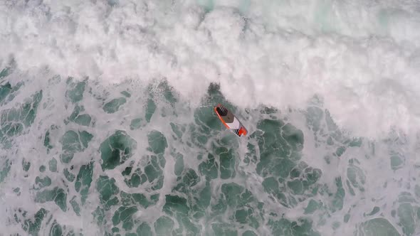 Aerial view of a wipeout sup stand-up paddleboard surfing in Hawaii