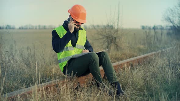 Foreman Designer On Train Station. Civil Engineer Developer With Helmet. Builder Constructor Foreman