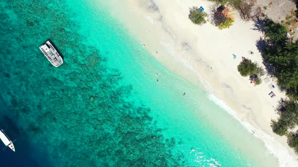 Aerial top view texture of paradise island beach lifestyle by blue ocean and white sandy background 