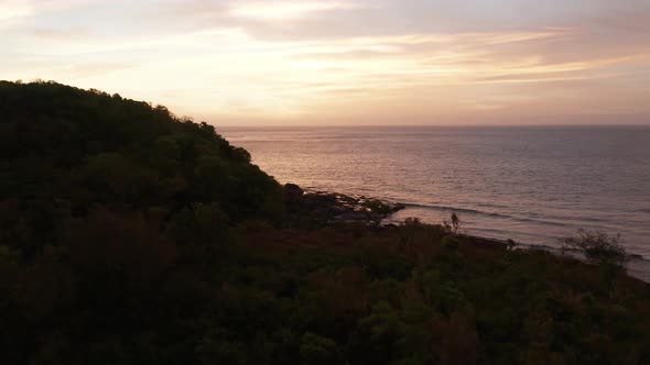 The Green Island Forest Island With Rocky Seashor And The Bright Sunset In Fiji. -aerial shot