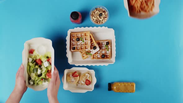 Food Delivery Top View Take Away Meals in Disposable Containers on Blue Background