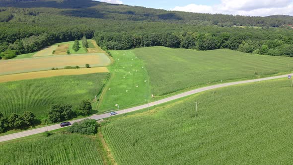 Car Moving on Road in Mountains Aerial View