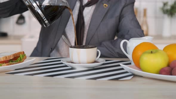 Cinemagraph of Businessman Pouring Coffee at Home