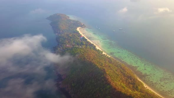 Aerial view of Phi Phi, Maya beach with blue turquoise seawater, mountain hills