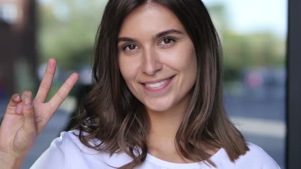 Winner, Victory Sign by Beautiful Girl Portrait