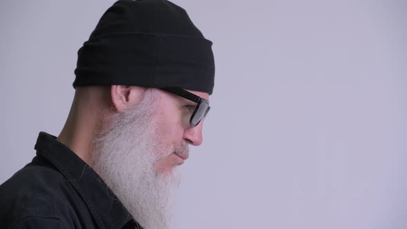 Closeup Profile View of Mature Bearded Hipster Man with Sunglasses