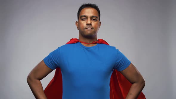 Happy Smiling Indian Man in Red Superhero Cape