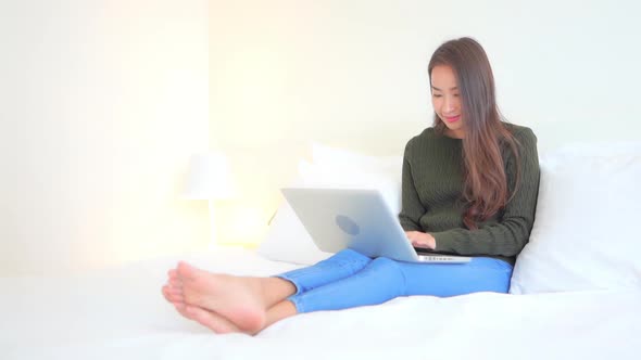 Young asian woman use laptop