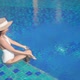 Young asian woman enjoy around outdoor swimming pool for leisure - VideoHive Item for Sale
