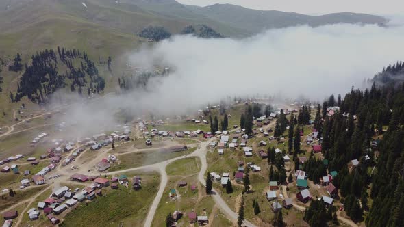 Misty Aerial View Of High Mountain Village